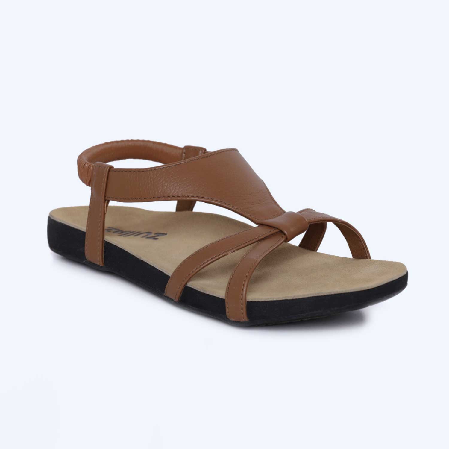 The Anna – Black sandal features a flat black sole, tan insole, open toe design, two front straps, and an ankle strap.