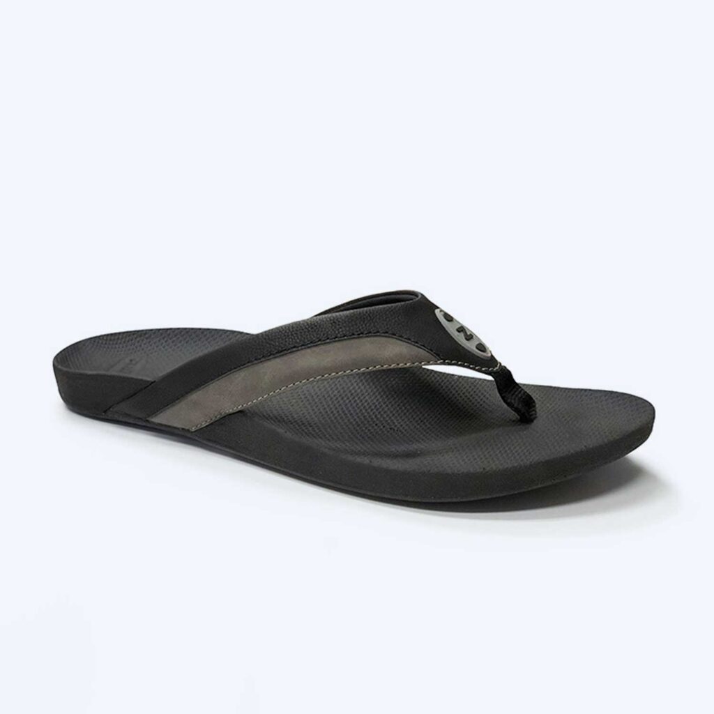 The Mens ‘Byron’ – Tan is a tan flip-flop sandal with a textured footbed and thong strap, shown on a plain light background.
