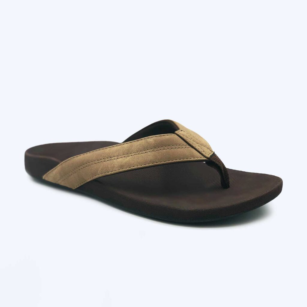 The Mens ‘Byron’ – Tan is a single tan flip-flop sandal featuring a thick fabric strap and dark sole, displayed against a plain light background.