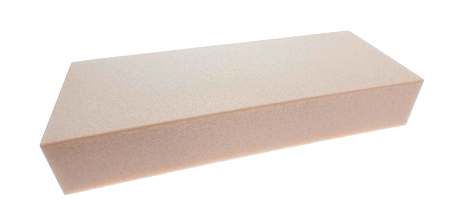 A rectangular beige foam block on a plain white background.